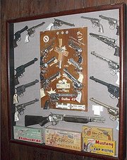 Cap gun This is a nice display of Nichols Industries cap guns with a good collection of some of the rarest models. Some collectors collect all brands.