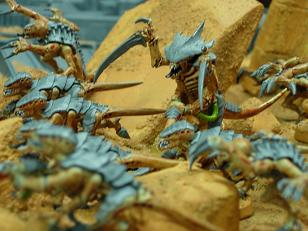 A small swarm of Tyranids, including a Warrior and several Termagents and Genestealers.