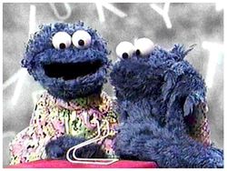 Cookie Monster (right) and his mother in a season 33 Letter of the Day segment, 2002.