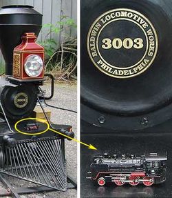 One of the smallest (Z scale, 1:220) placed on the buffer bar of one of the largest (Live steam, 1:8) model locomotives.