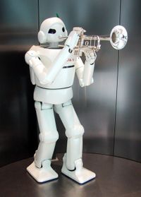 A humanoid robot manufactured by Toyota "playing" a trumpet