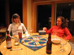 Two women playing Trivial Pursuit.