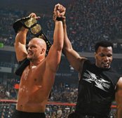 Steve Austin celebrates with Mike Tyson after winning the WWF title at WrestleMania XIV.